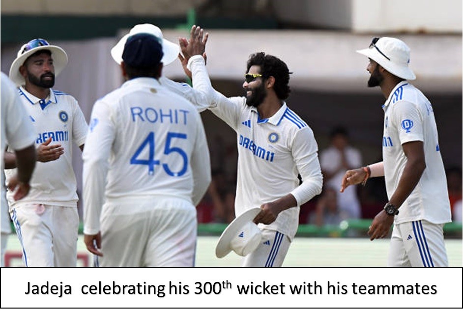 jadeja celebrating his 300 th wicket with his teammates